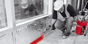 Firestop (by Hilti) being sprayed on where the wall and floor meet